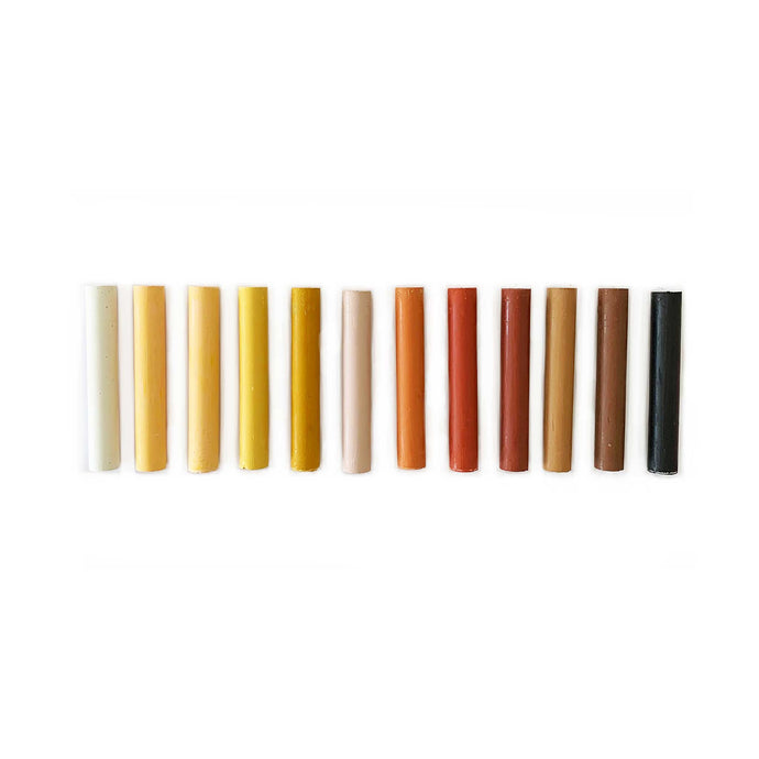set of twelve oil pastels in skin tone colours of the world