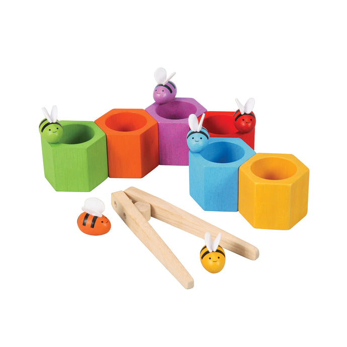 6 coloured wooden beehives and bees placed together in the pllantoys beehives sorting and stacking game