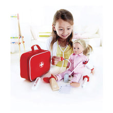 Load image into Gallery viewer, young girl playing with doctor play set and doll

