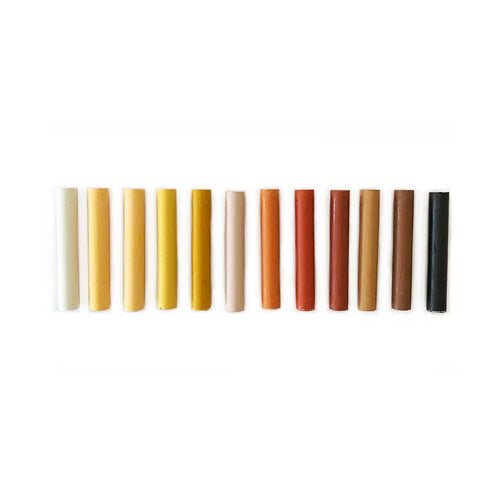 set of twelve oil pastels in skin tone colours of the world